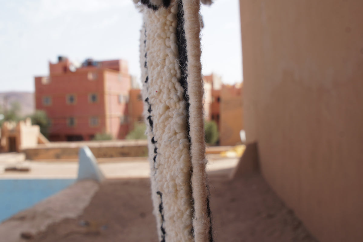 MINIINIMALIST BENI OURAIN MOROCCAN RUG- BLACK IVORY WOOL PIECE